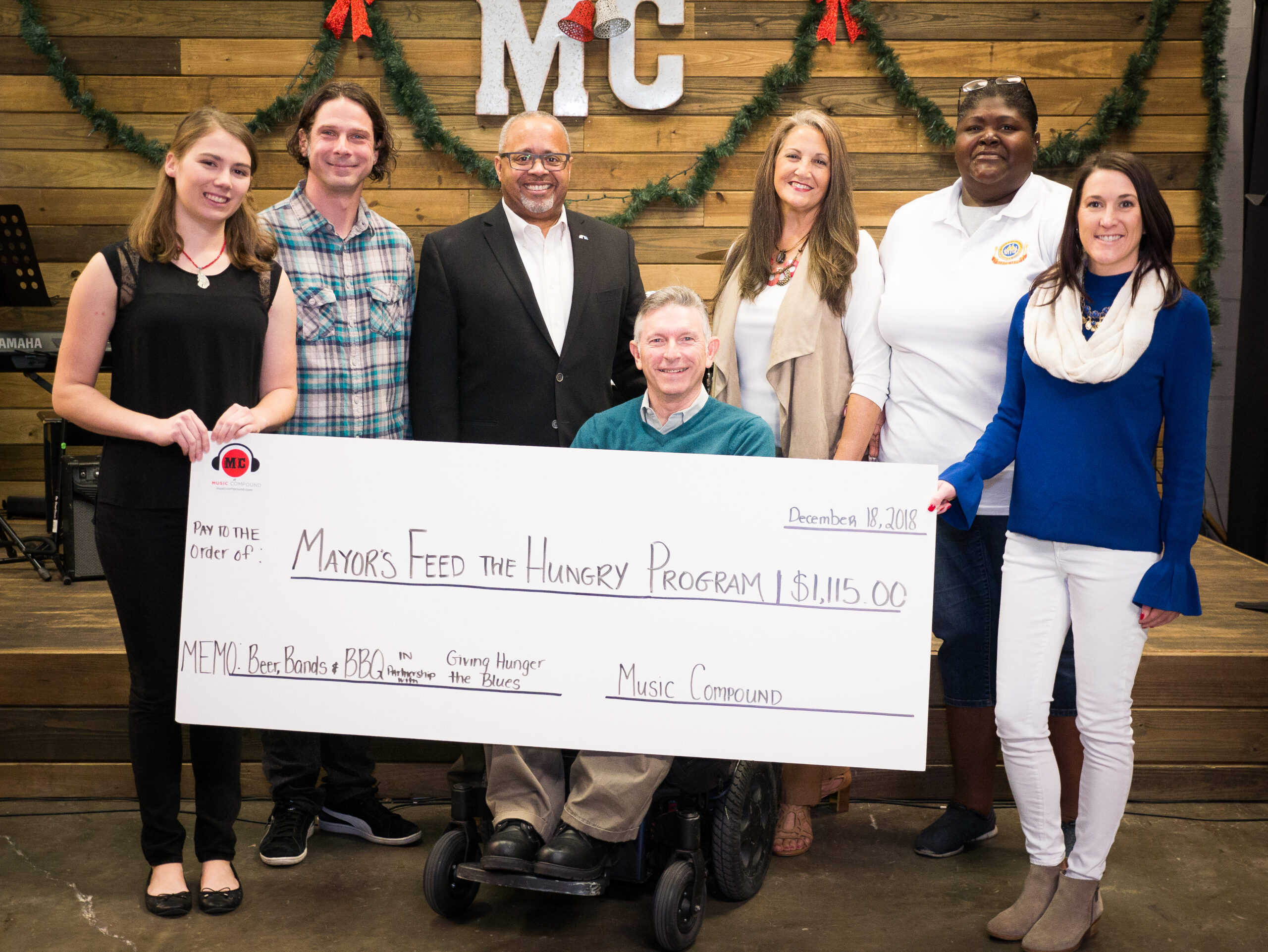 Music Compound spreads holiday cheer to Mayor’s Feed the Hungry Program