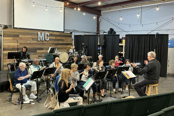 The Gulf Coast New Horizons Concert Band, led by David DeWitt (right), during a recent rehearsal